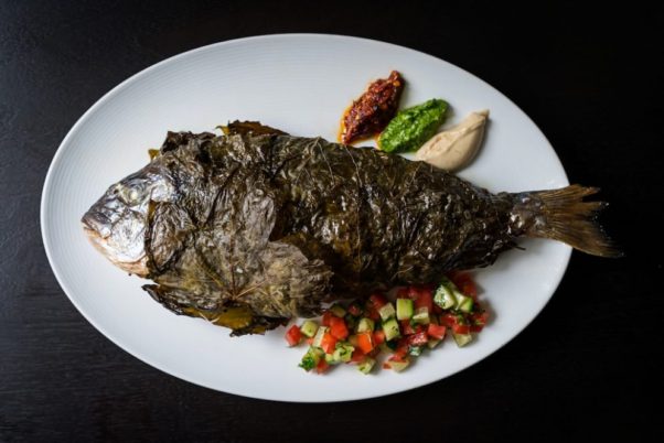 Sababa will feature modern Isreali cuisine including a daily whole roasted fish wrapped in grape leaved. (Photo: Scott Suchman)