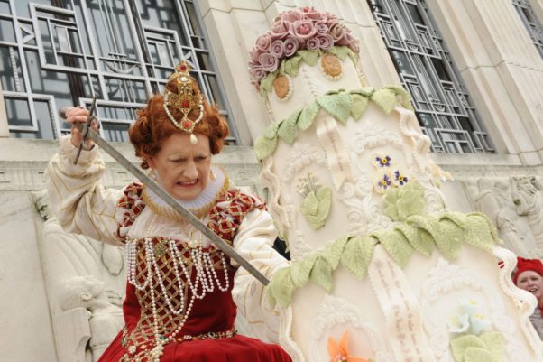Queen Elizabeth I cuts William Shakespeare's birthday cake at the Folger Shakespeare Library. (Photo: Lloyd Wolf/Folger shakespeare Library)