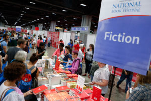 Shoppers browse fiction books at the National Book Festival. (Photo: Shawn Miller/Library of Congress)