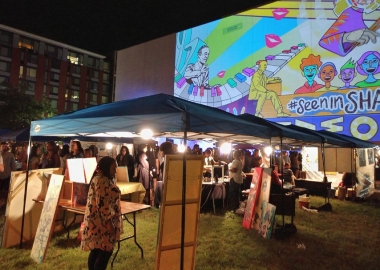 A giant animated Love Shaw projection looming over the art market. (Photo: Alexander M. Padro)