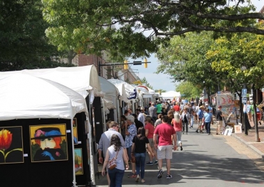 People walking along booths at the 2017 King Street Art Festival in Old Town. (Photo: Howard Alan Events)