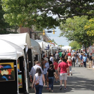 People walking along booths at the 2017 King Street Art Festival in Old Town. (Photo: Howard Alan Events)