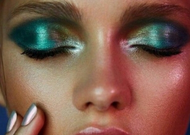 Woman's eyes with metallic green eyeshadow. (Photo: GirlsCosmo)