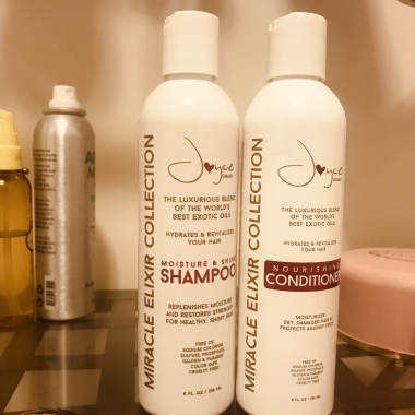 Bottles of shampoo and conditioner from the Joyce Giraud Miracle Elixir Collection sitting beside each other on a bathroom counter. (Photo: Emma Blancovich/DC on Heels)