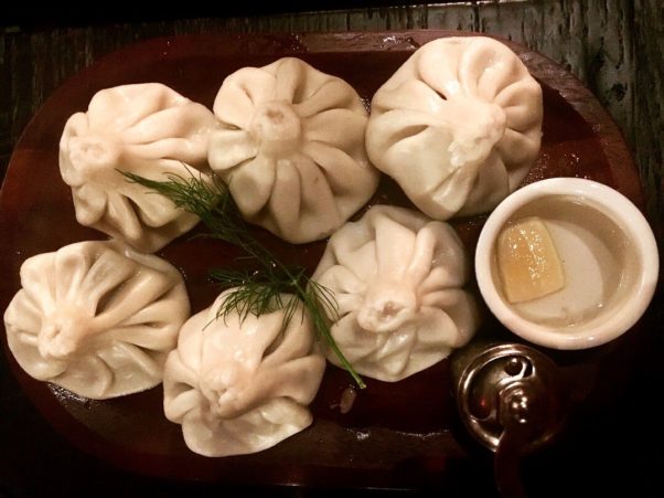 Six Khinkahali soup dumplings that look like little purses from Supra on a plate. (Photo: Supra)