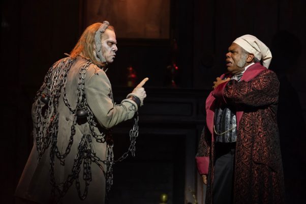 Ebenezer Scrooge (right) is visited by the ghost of Jacob Marley in Ford's Theater's <em>A Christmas Carol</em>. (Photo: Scott Suchman)