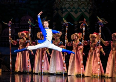The Nutcracker leaps into the air in front of five women. (Photo: Luke Isley)