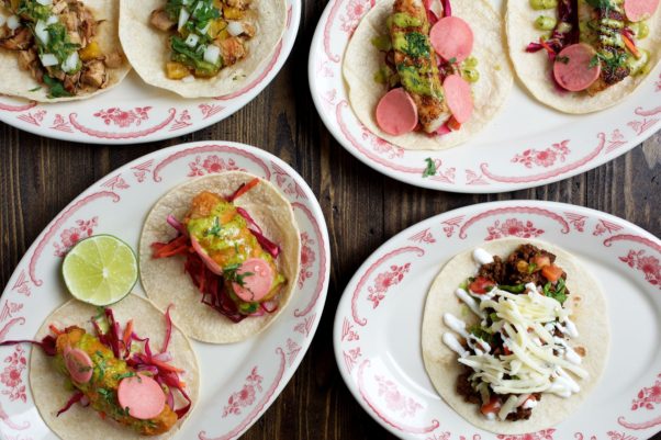 Four kinds of tacos on plates. (Photo: El Bebe)