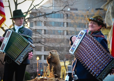 A male and female according player play in Dupont Circle with a stuffed groundhog standing between them. (Photo: Dupont Festival)
