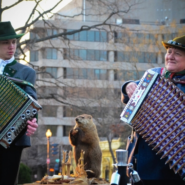 A male and female according player play in Dupont Circle with a stuffed groundhog standing between them. (Photo: Dupont Festival)
