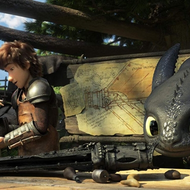 Astrid, voiced by America Ferrera, and Hiccup, voiced by Jay Baruchel, make an artificial for Toothless as he looks on. (Photo: Universal Pictures)