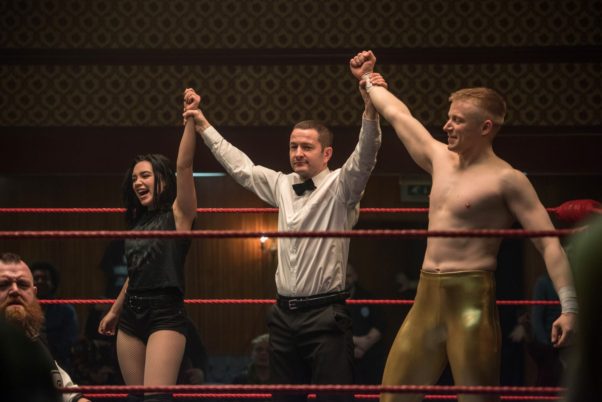 Saraya Knight/Paige (Florence Pugh) and brother Zac Knight (Jack Lowden) are declared winners in a tag team wrestling match. (Photo: MGM)