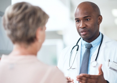 African American male doctor talking with a female patient. (Photo: Getty Images)