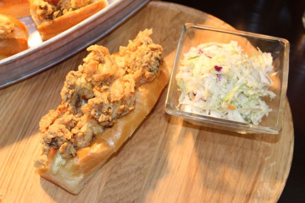 An oyster po'boy with a side of coleslaw. (Photo: Mark Heckathorn/DC on Heels)