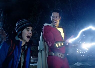 Freddy Freman (Jack Dylan Grazer) and Shazam (Zachary Levi) laugh as lightning shoots out of Shazam's hands. (Photo: Warner Bros. Pictures)
