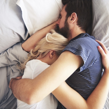 White man and woman holding each other sleeping in bed. (Photo: 123rf)
