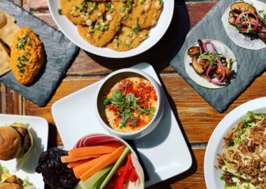 Various dishes from Jack Rose Dining Saloon's rooftop terrace menu including mushroom tacos, hummus and sliders. (Photo: Jack Rose Dining Saloon)