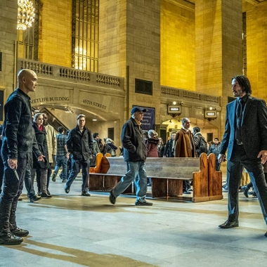 John Wick (Keanu Reeves, right) and Zero (Mark Dacascos, left) prepare to fight in a busy train station. (Photo: Lionsgate Films)