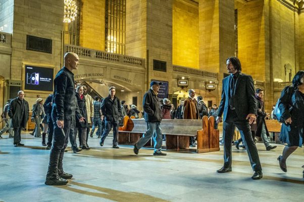 John Wick (Keanu Reeves, right) and Zero (Mark Dacascos, left) prepare to fight in a busy train station. (Photo: Lionsgate Films)