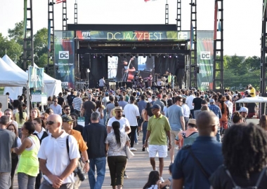 People at the D.C. Jazz Festival walking on a pier at The Wharf in front of the stage. (Photo: D.C. Jazz Festival)