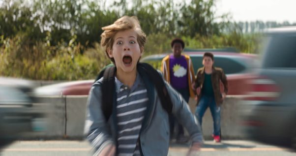 Max (Jacob Tremblay) crosses a busy highway as Lucas (Keith L. Williams) and Thor (Brady Noon) watch from the center of the road. (Photo: Universal Pictures)