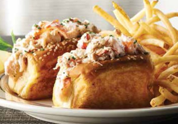 Twin petite lobster rolls on a plate with fries. (Photo: Oceanaire)