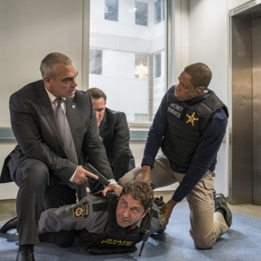 Gerard Butler stars as Mike Banning (Gerard Butler) is held on the floor by three police with guns pointed at him. (Photo: Jack English/Lionsgate Films)