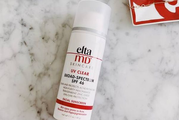 Bottle of Elta MD Clear Facial Sunscreen Broad-Spectrum SPF 46 laying on a marble countertop. (Photo: Danielle Goldmark)