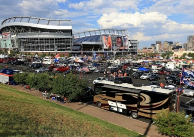 Cars and RVs parked outside a football stadium. (Photo: Getty Images)