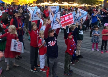 Fans holdng up signs at a World Series watch party last weekend at Yards Park. (Photo: Capital Riverfront)