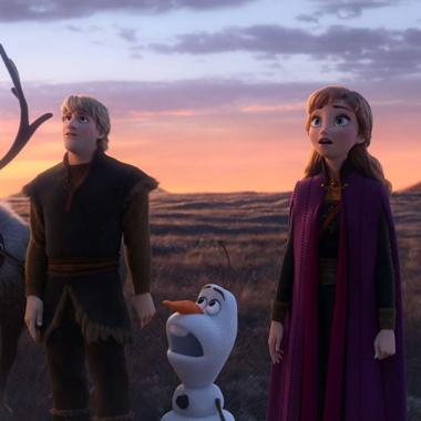 Sven, Kristoff, Olaf, Anna and Elsa standing in a grassy field looking up at something outside the picture. (Photo; Walt Disney Studios)