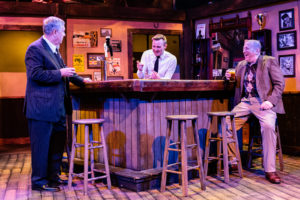 David (left) at his bar in Dublin talks with the bartender and a customer on Christmas Eve. (Photo: Keegan Theatre)