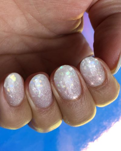 woman with white glitter coverning her nails. (Photo: Michelle Humphrey/Instagram)