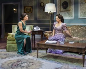 Erin Weaver and Kimberly Gilbert sit in a living room in "Sheltered." (Photo: Teresa Castracane)