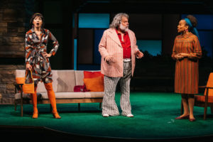 Mrs. Page (Regina Aquino, left) and Mrs. Ford (Ami Brabson, right), Windsor’s merry wives, having fun retaliating against a conniving Falstaff (Brian Mani, center). (Photo: Cameron Whitman Photography)