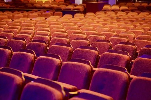 Empty theater seats covered in red velvet. (Photo: ballardinix/Pixabay)