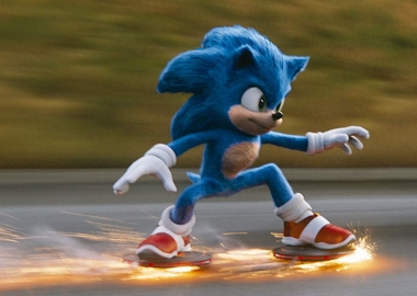 Sonice the Hedgehog racing down the road with sparks coming from his shoes. (Photo: Paramount Pictures)