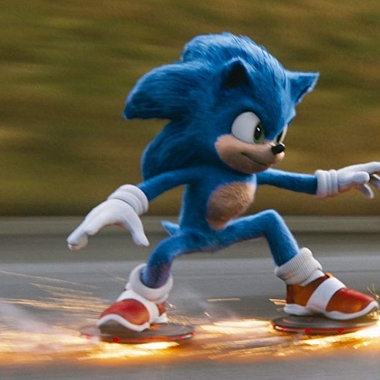 Sonice the Hedgehog racing down the road with sparks coming from his shoes. (Photo: Paramount Pictures)