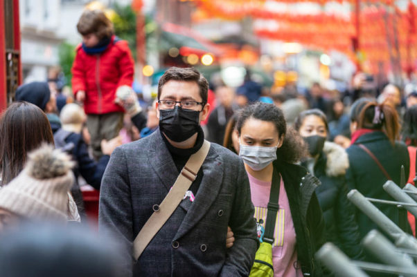 People wearing a face masks to protect themselves from COVID-19 in London. (Photo: iStock)