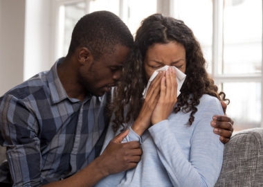 African American couple. Man is holding crying woman. (Photo: Shutterstock)
