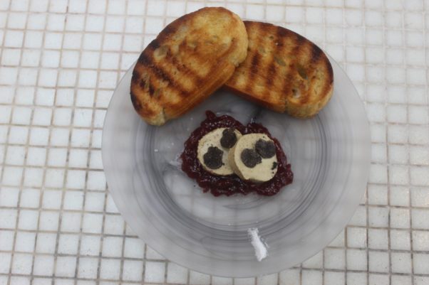 Slates oie and black truffle pate on a clear plate with two slices of grilled bread. (Photo: Mark Heckathorn/DC on Heels)