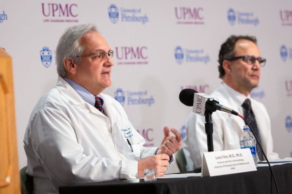 Dr. Louis Falo speaks Thursday during a press conference. Dr. Andrea Gambotto is in the background. (Photo: University of Pittsburgh)