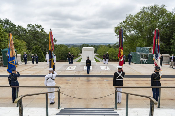A member of the Old Guard place a wreath at the Tomb of the Unknown Soldier with a military color guard at attention during the Memorial Day observance on May 25, 2020. (Photo: Elizabeth Fraser/U.S. Army/Arlington National Cemetery)