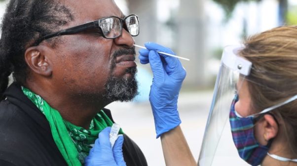 A Black man getting a nasal swab coronavirus test. (Photo: Getty Images)