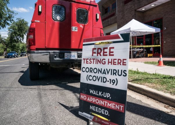 A Southeast fire station with a sign in front that says "Free testing here. Coronavirus (COVID-19). Walk-up. No appointment needed." (Photo: Dee Dwyer/APM Reports)
