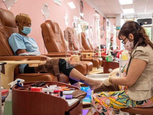 A woman gets her toenails painted at a nail salon in Austin, Texas on May 8, 2020. (Photo: Sergio Flores/AFP via Getty Images)