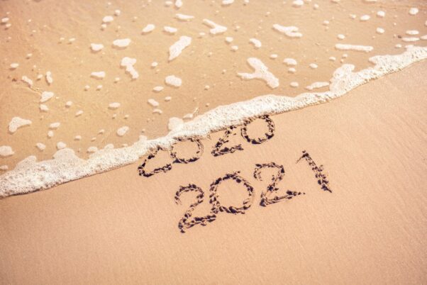 New Year 2021 replaces 2020 written in the sand on the beach. (Photo: iStock)