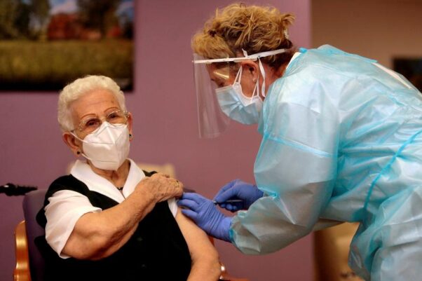 A 96-year-old woman gets her first dose of the Pfizer vaccine in Spain. (Photo: Pepe Zamora/Reuters)