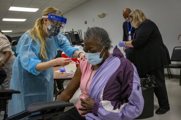 A Black woman gets the COVID-19 vaccine in Camden, N.J., on Jan. 21, 2021. (Photo: Alejandro Alvarez/Philadelphia Inquirer)