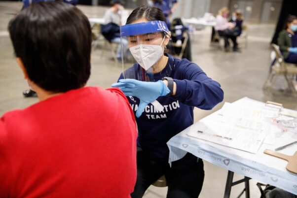 A person gets vaccinated against COVID-19 on March 6, 2021, in the Walter E. Washington Convention Center. (Photo: George Washington University)
